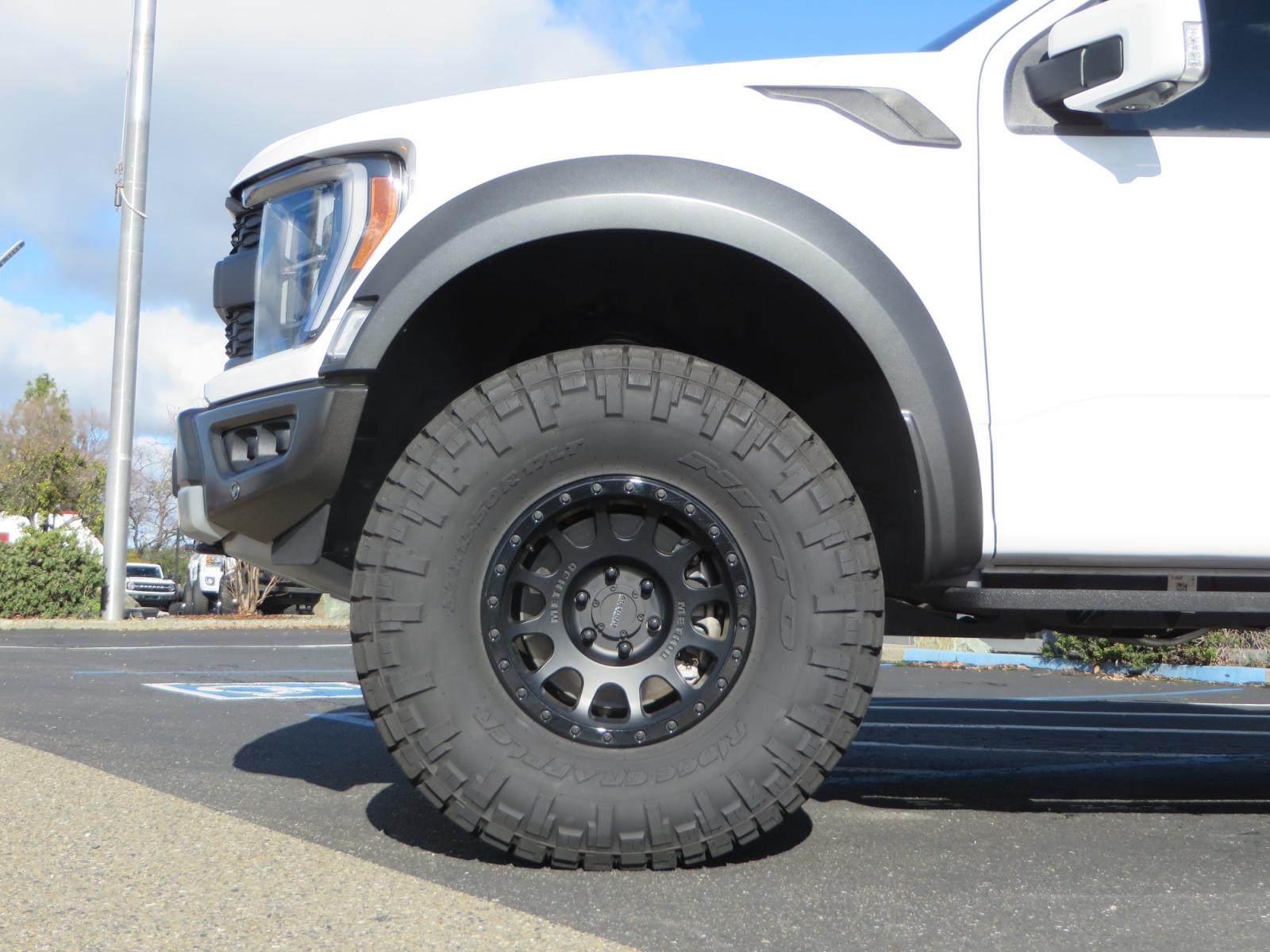 2023 White /BLACK Ford F-150 Raptor SuperCrew 4WD (1FTFW1RG6PF) with an 3.5 V6 engine, 6A transmission, located at 2630 Grass Valley Highway, Auburn, CA, 95603, (530) 508-5100, 38.937893, -121.095482 - Raptor sitting on Eibach front and rear springs, 37" Nitto Ridge Grappler tires, 17" Method NV wheels, and window tint. - Photo #7